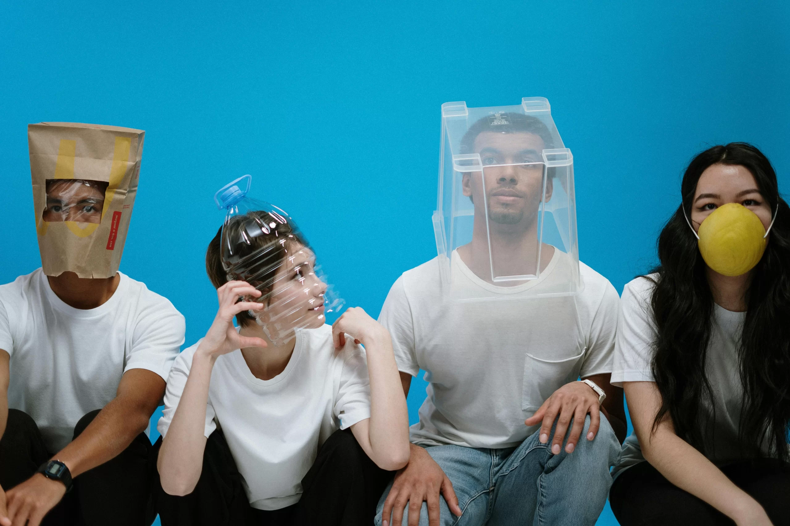 A group of peer covering their nose just to avoid the bad smell of breath.