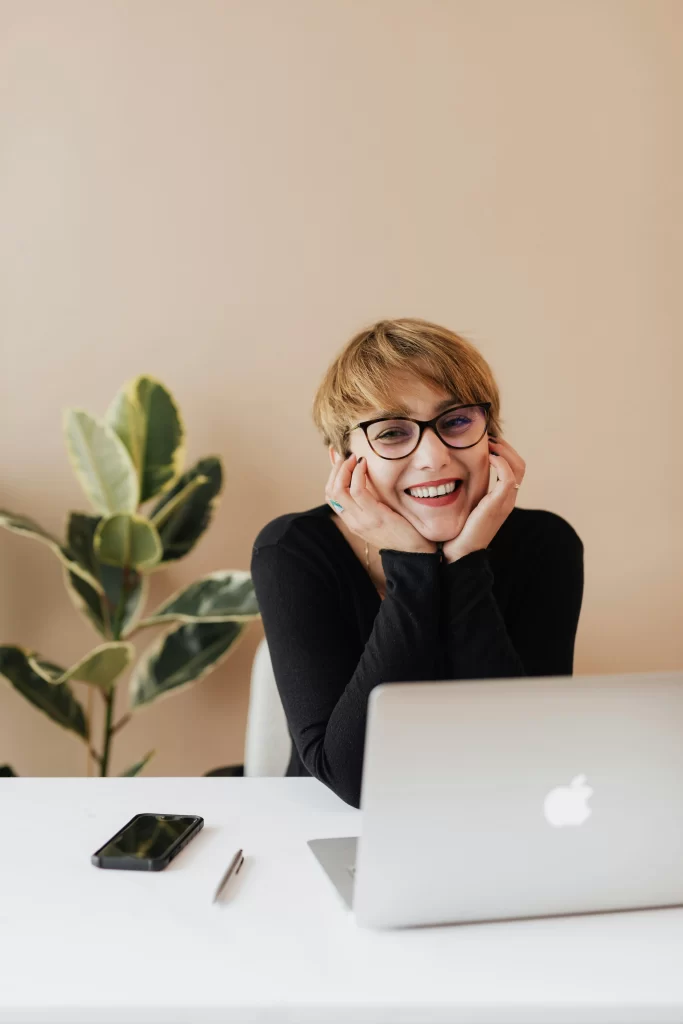 A cheerful woman smiling; the future of cosmetic dentistry.