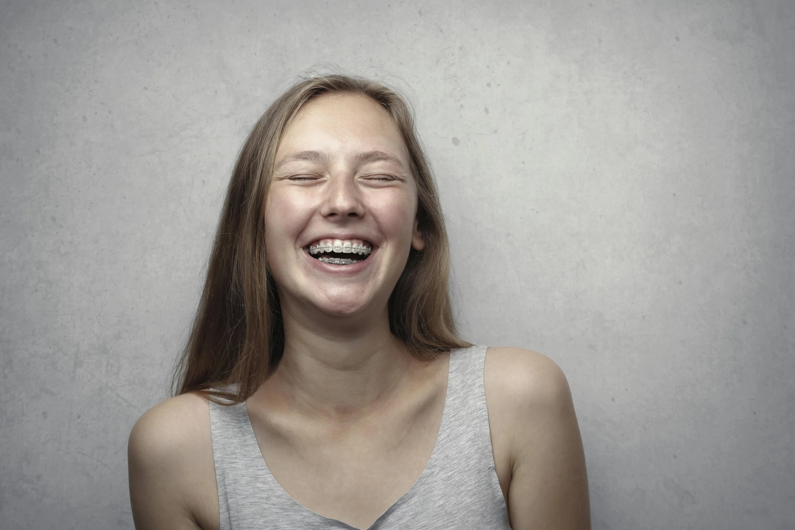 How long should you wear retainers after braces?