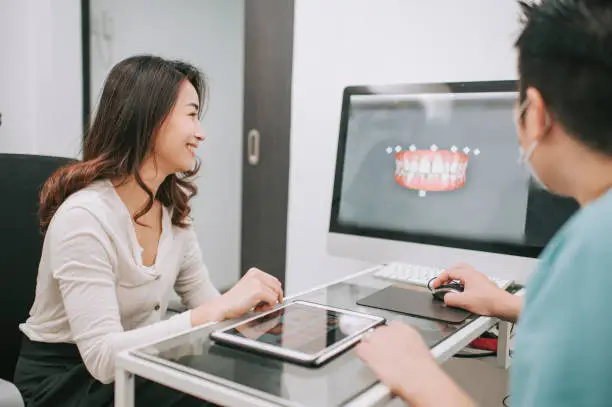 dentist with patient consultation