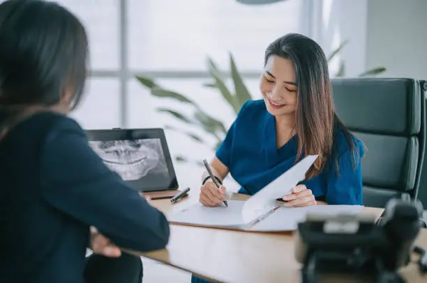 dentist with patient consultation