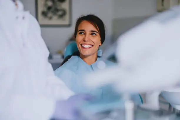 dentist with patient smiling