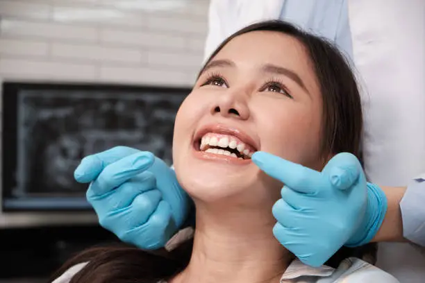 dentist with patient smiling