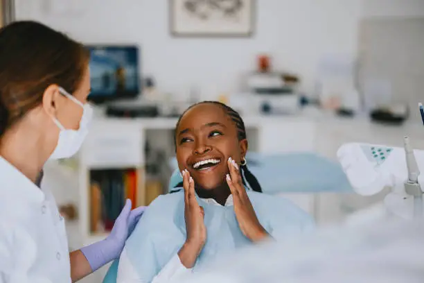 dentist with patient smiling