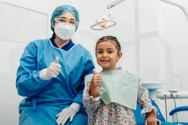 A dentist taking care of the child's teeth.