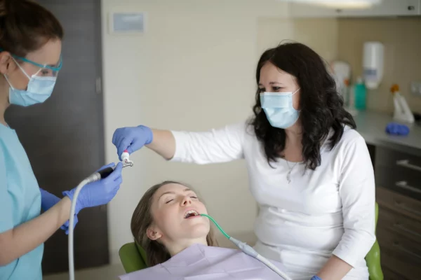 A patient is undergoing a cavity filling treatment.